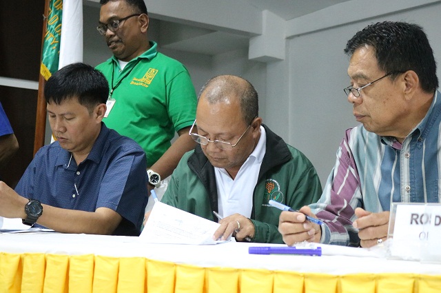 PhilRice Isabela Director, Leo C. Javier, together with the station's partners, signing the Memorandum of Agreement during the launching of the SOA program on climate smart agriculture in Cagayan Valley